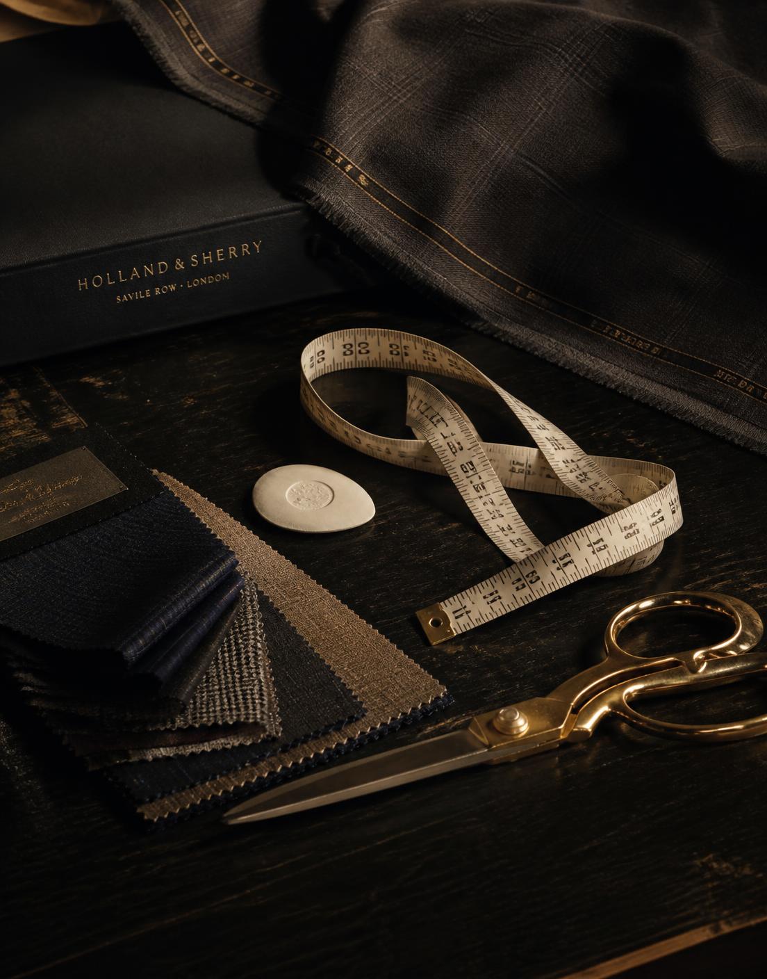 Tailoring tools, fabric swatches and gold shears in the U-Like Tailors studio
